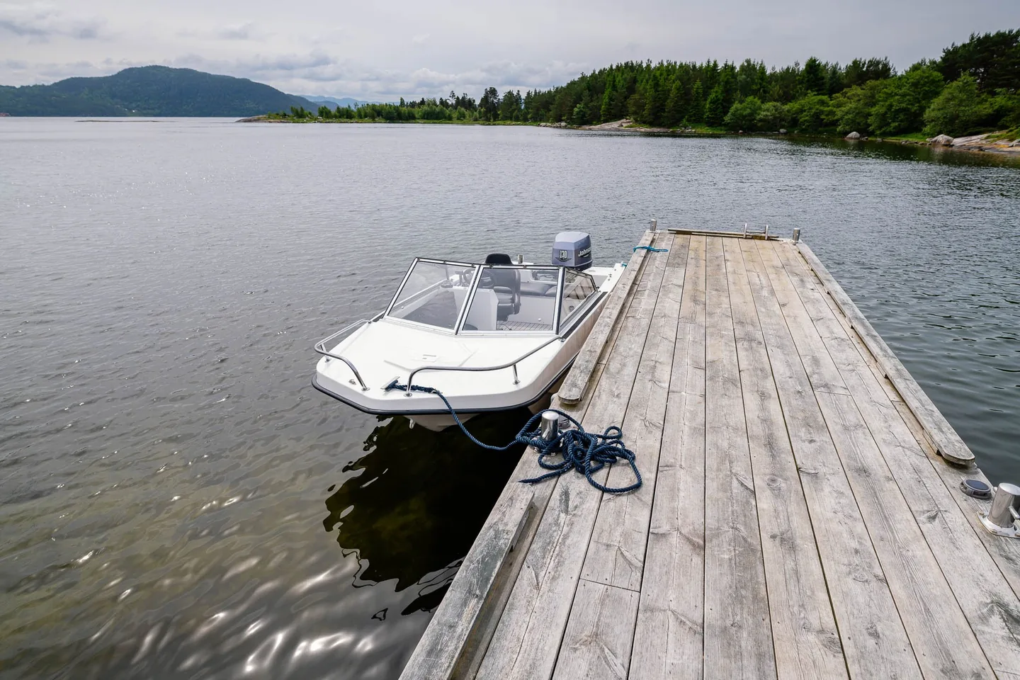Trifoil 100GT moored alongside a wooden jetty