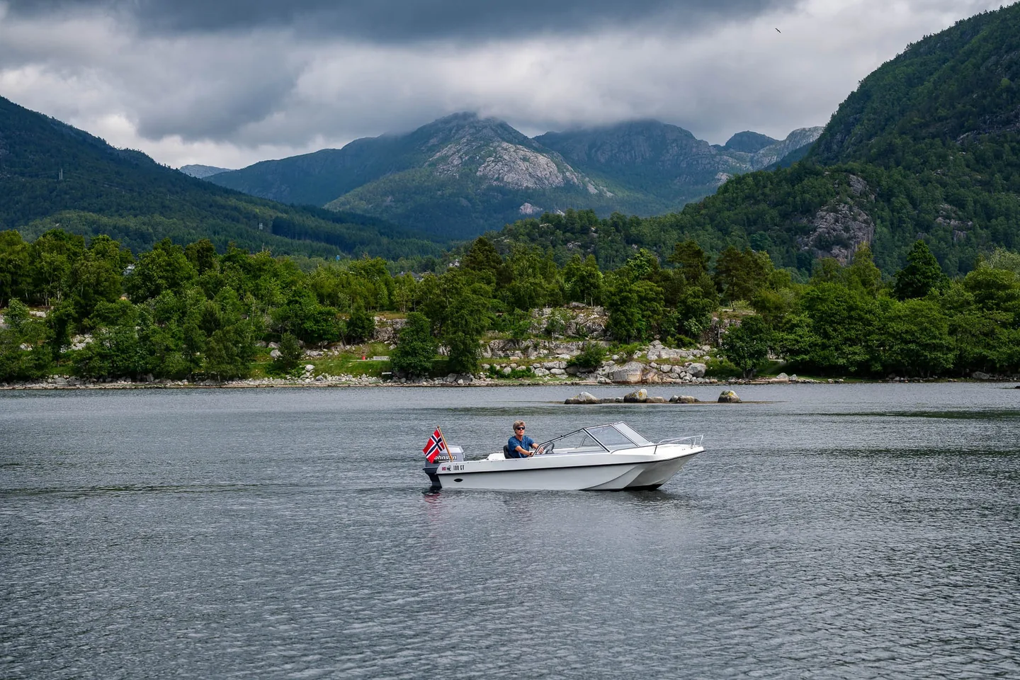 A side view of Trifoil 100GT beneath the mountains