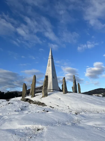 Solspeilet and standing stones in snow